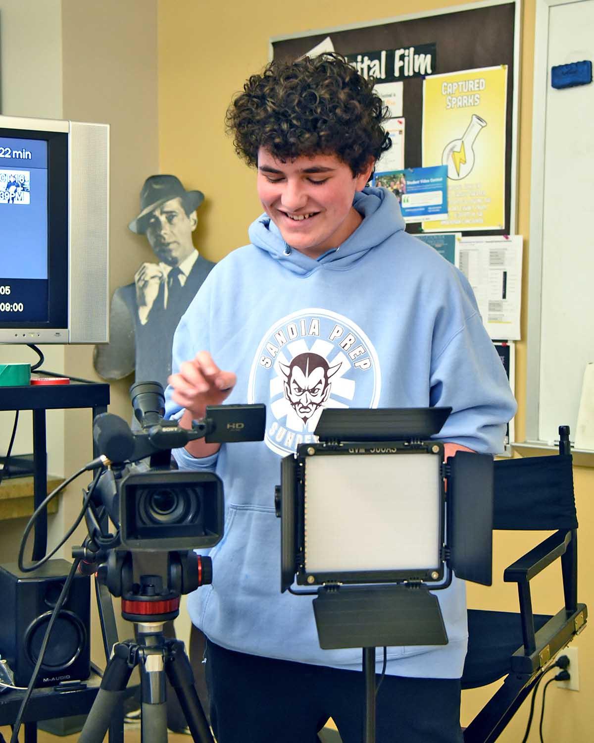 Film student works with video camera