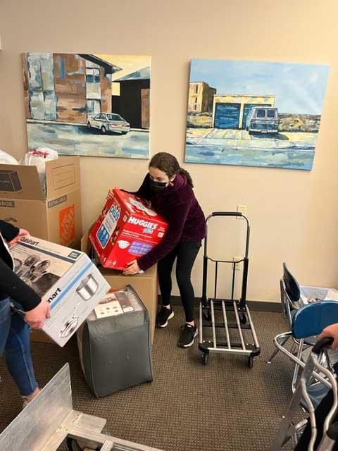 Students gather diapers and other items for PB&J Family Services.