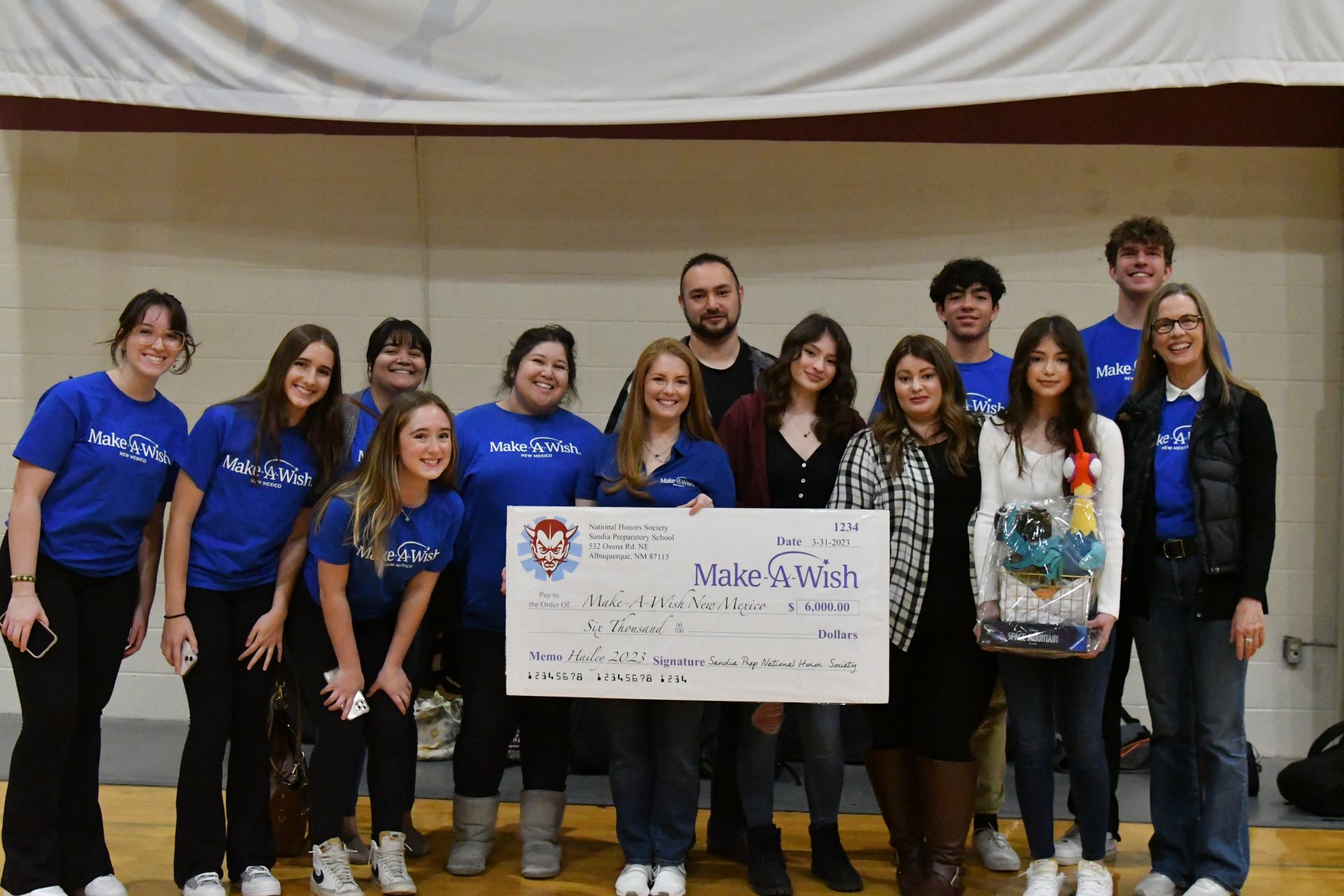 Sandia Prep NHS students present check to Wish Kid