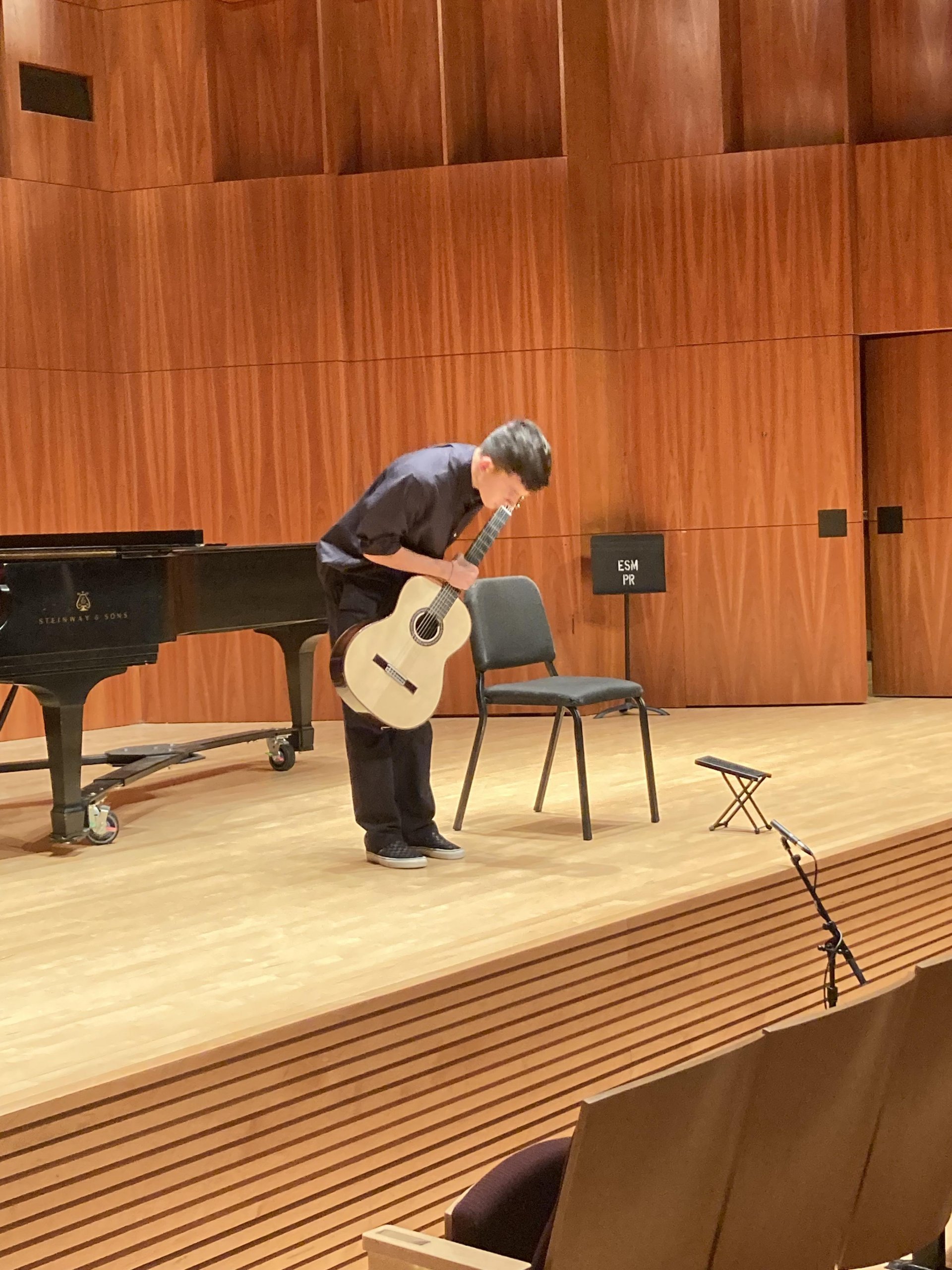 Guitar student Jacob Perez '24 on stage 