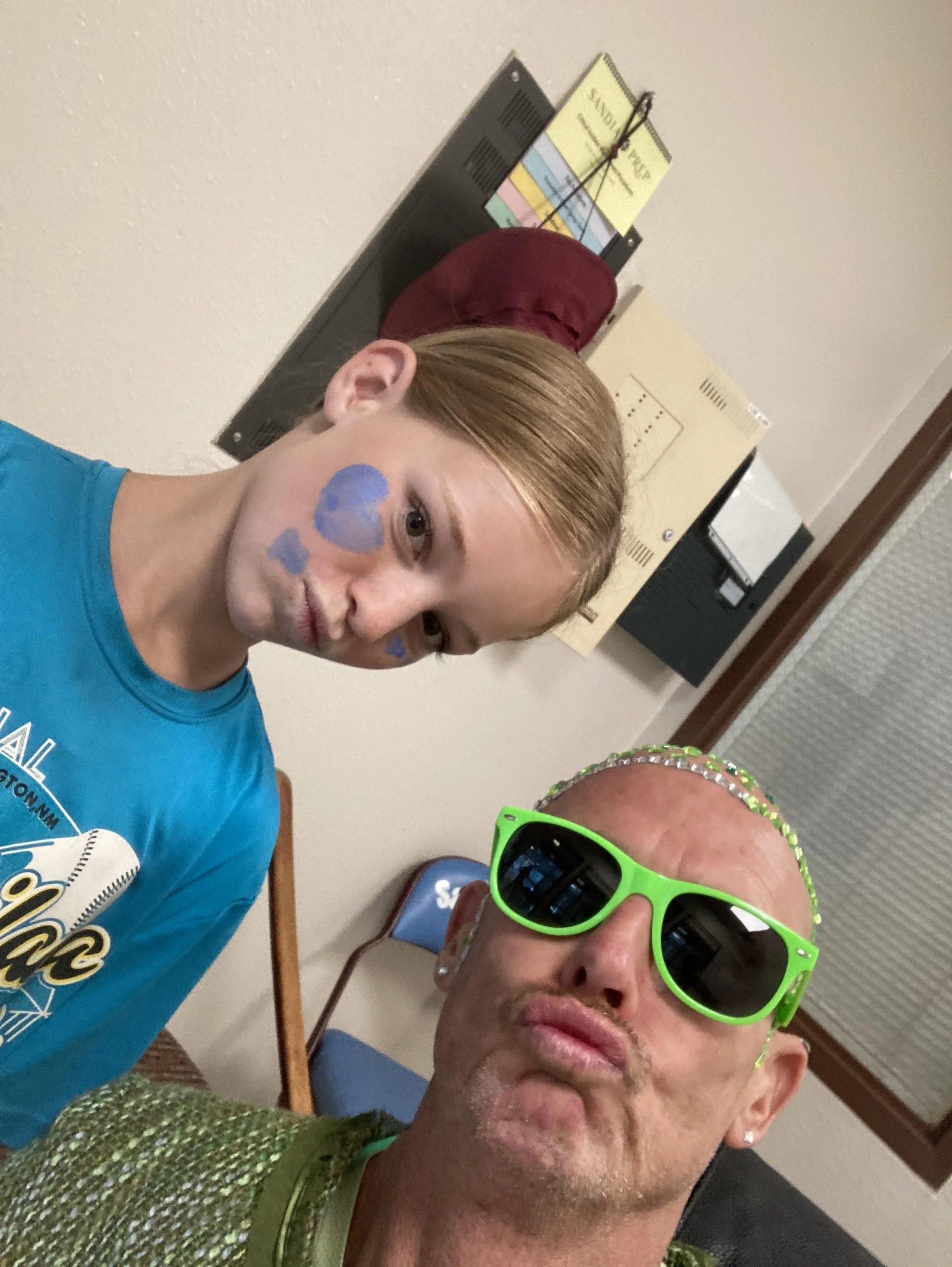 Paul Huitt celebrates Spirit Week Color Day 2024 with a student.