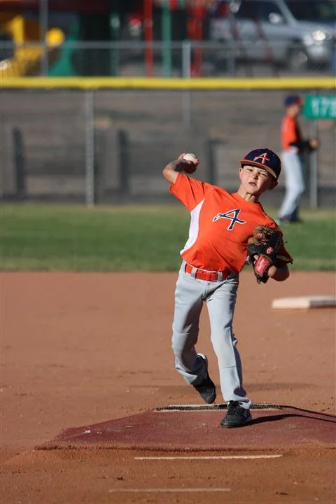 A young Logan Lemons pitching