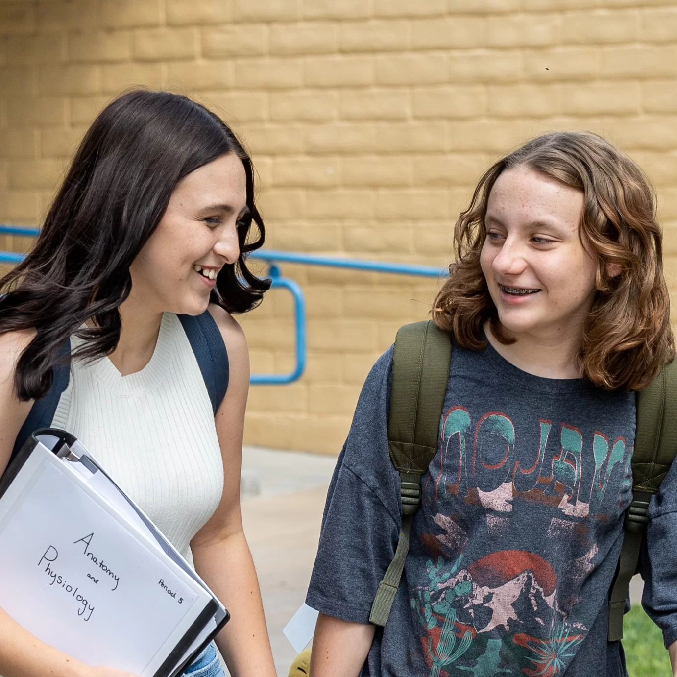 open house - two students walking on campus